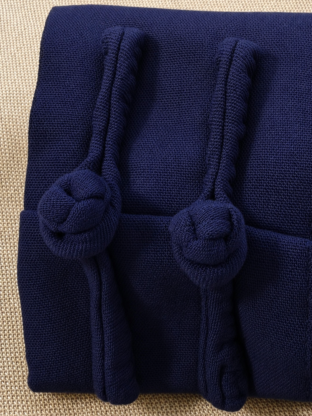Handmade traditional frog button detail on midnight blue Tai Chi practice wear
