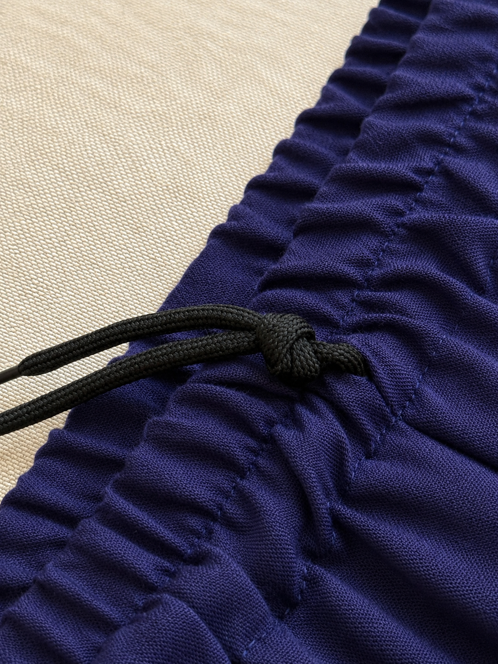 Adjustable elastic waistband detail on midnight blue Tai Chi pants
